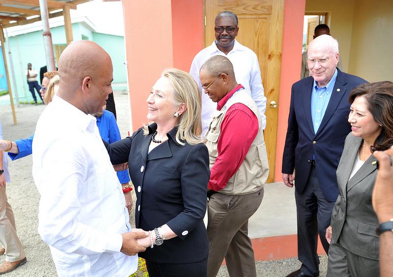 Secretary Clinton Is Welcomed By Haitian President Martelly