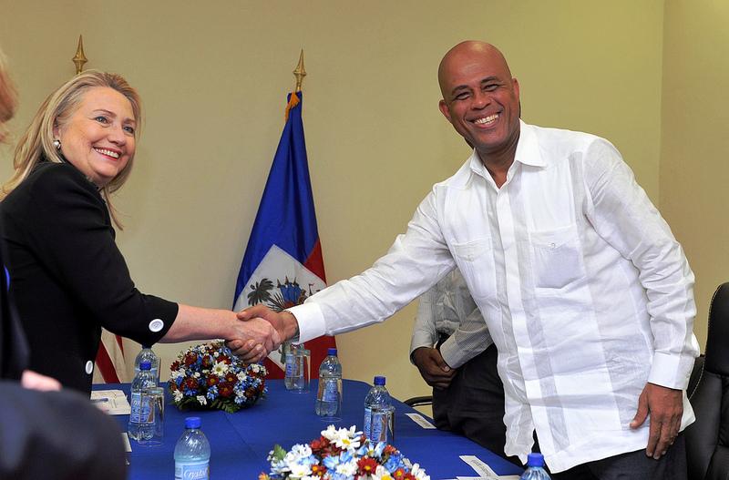 Secretary Clinton Shakes Hands With Haitian President Martelly